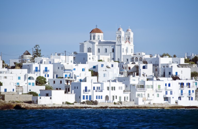 Elegant white houses of Paros with beautiful sea views, showcasing the charm of the Greek islands.