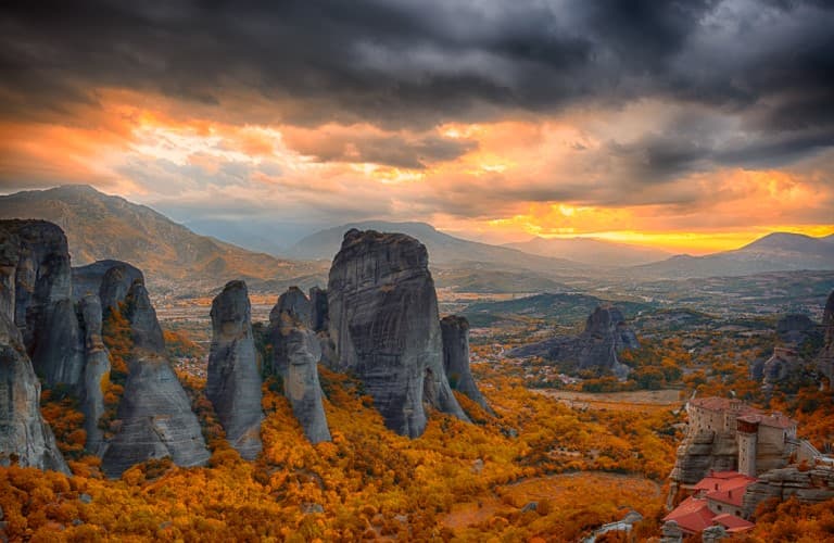 Amazing view of Meteora monasteries built on high mountain cliffs surrounded by spectacular natural scenery in Greece.