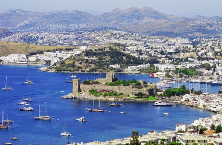 Discover Bodrum’s beautiful coastline with luxury yachts, traditional boats, crystal-clear sea, and stunning natural scenery on the Turkish Riviera.