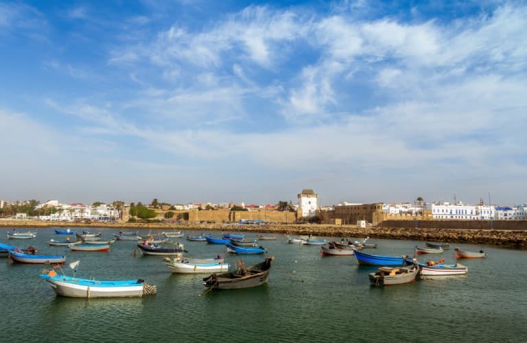 Beautiful view of Essaouira featuring historic medina streets, Atlantic coastline, blue sea, and charming Moroccan tourism atmosphere.