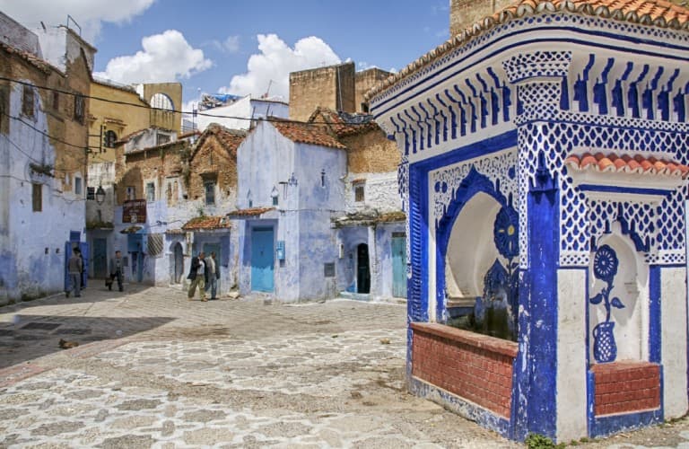 Explore Chefchaouen in Morocco with charming narrow streets, blue-painted buildings, colorful scenery, and unique cultural atmosphere.