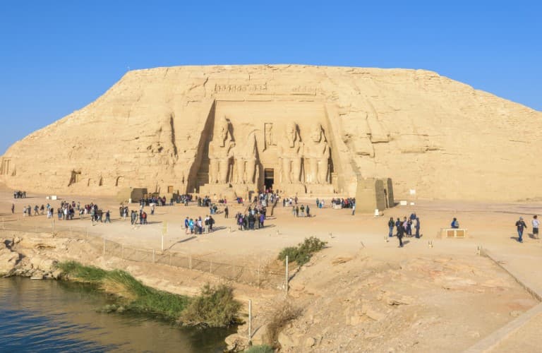 Travelers explore the unique white rock formations and stunning desert landscapes of Egypt’s White Desert National Park.