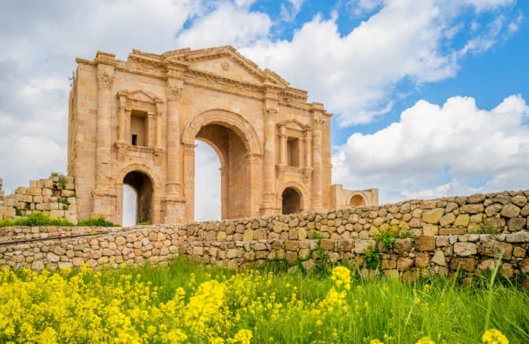 Scenic view of Ajloun region in Jordan featuring lush green hills, forested landscapes, and historic castle ruins offering a peaceful nature and cultural tourism destination