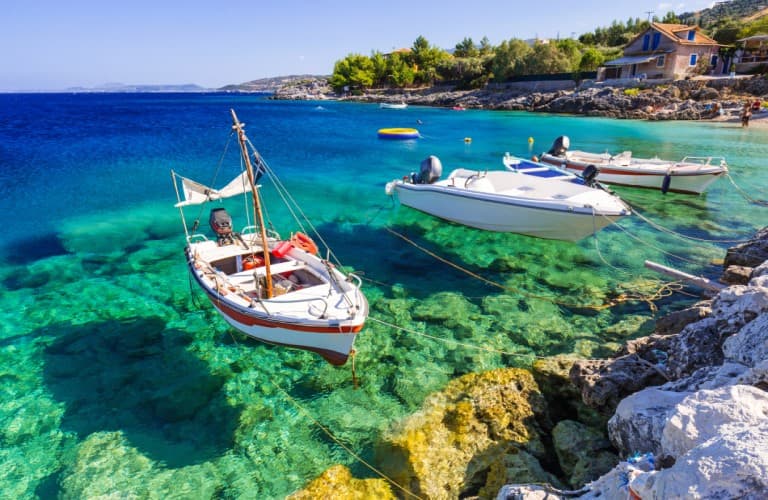 Crystal-clear waters and traditional Greek cuisine creating an unforgettable Mediterranean travel experience in Greece.