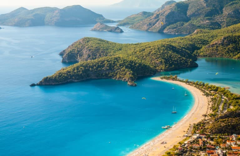 Oludeniz in Fethiye is one of Turkey’s most famous coastal destinations, known for its crystal-clear turquoise waters, stunning beaches, and breathtaking natural scenery.