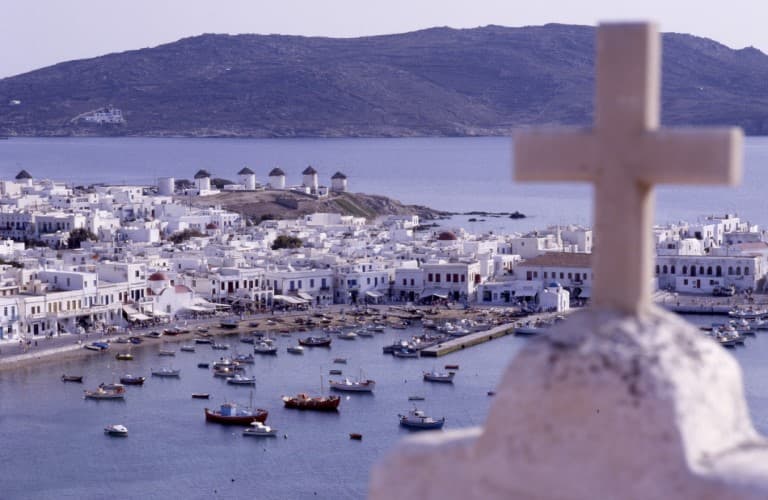Mykonos is famous for its whitewashed houses, scenic coastal views, and vibrant Mediterranean atmosphere.