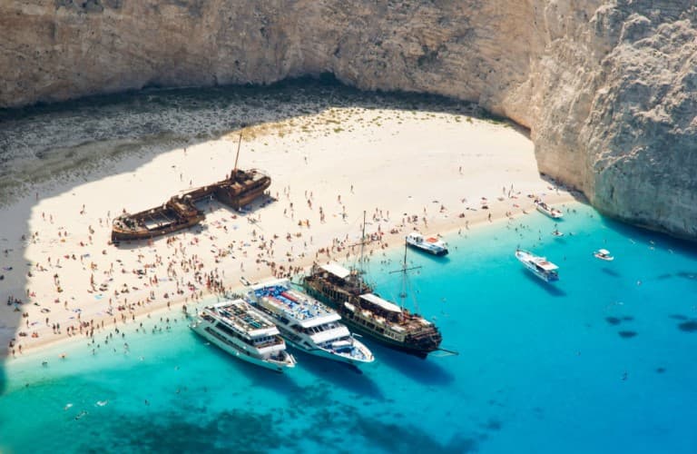 Navagio Beach in Zakynthos with turquoise waters and dramatic coastal cliffs