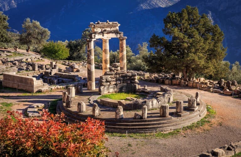 Ancient ruins of Delphi surrounded by mountains, one of Greece's most famous archaeological sites
